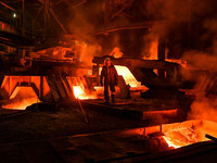 A worker is performing his duties in a blast furnace shop at Zaporizhstal Iron and Steel Works in Zaporizhzhia, Ukraine, on May 3, 2024. (