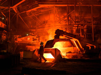 A worker is performing his duties in a blast furnace shop at Zaporizhstal Iron and Steel Works in Zaporizhzhia, Ukraine, on May 3, 2024. (