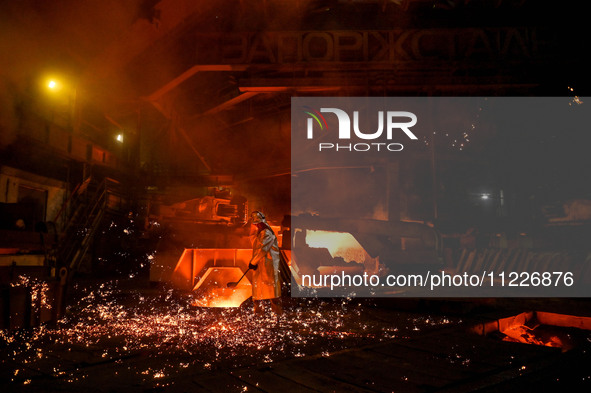 A worker is performing his duties in a blast furnace shop at Zaporizhstal Iron and Steel Works in Zaporizhzhia, Ukraine, on May 3, 2024. 