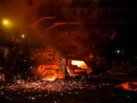 A worker is performing his duties in a blast furnace shop at Zaporizhstal Iron and Steel Works in Zaporizhzhia, Ukraine, on May 3, 2024. (