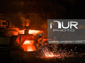 Workers are performing their duties in a blast furnace shop at Zaporizhstal Iron and Steel Works in Zaporizhzhia, southeastern Ukraine, on M...