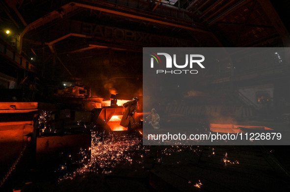 Workers are performing their duties in a blast furnace shop at Zaporizhstal Iron and Steel Works in Zaporizhzhia, southeastern Ukraine, on M...