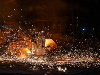 A worker is performing his duties in a blast furnace shop at Zaporizhstal Iron and Steel Works in Zaporizhzhia, Ukraine, on May 3, 2024. (