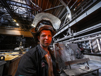 A worker is posing for a picture in a blast furnace shop at Zaporizhstal Iron and Steel Works in Zaporizhzhia, Ukraine, on May 3, 2024. (