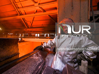 A worker is posing for a picture in a blast furnace shop at Zaporizhstal Iron and Steel Works in Zaporizhzhia, Ukraine, on May 3, 2024. (