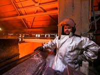 A worker is posing for a picture in a blast furnace shop at Zaporizhstal Iron and Steel Works in Zaporizhzhia, Ukraine, on May 3, 2024. (