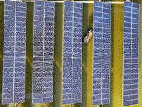 Employees of State Grid Fuzhou Power Supply Company are inspecting photovoltaic equipment in Xincuo town, Fuqing city, Fujian province, Chin...