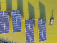 Employees of State Grid Fuzhou Power Supply Company are inspecting photovoltaic equipment in Xincuo town, Fuqing city, Fujian province, Chin...