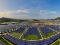 Photovoltaic panels are glowing under the setting sun in Xincuo town, Fuqing city, Fujian province, China, on May 10, 2024. (