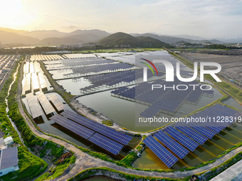 Photovoltaic panels are glowing under the setting sun in Xincuo town, Fuqing city, Fujian province, China, on May 10, 2024. (