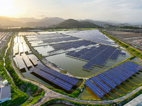 Photovoltaic panels are glowing under the setting sun in Xincuo town, Fuqing city, Fujian province, China, on May 10, 2024. (