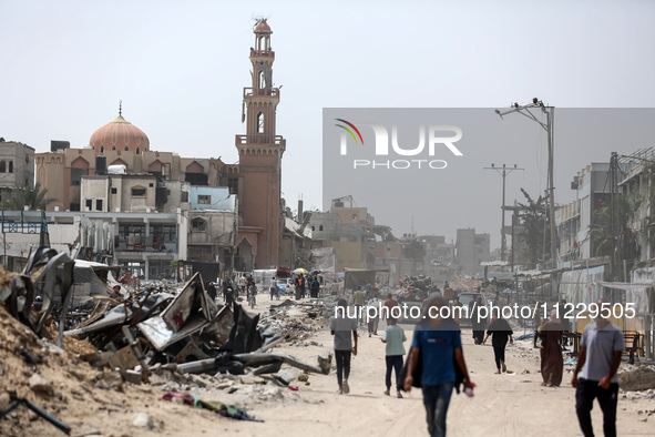 Displaced Palestinians are setting up shelter after returning to Khan Yunis in the southern Gaza Strip, amid the ongoing conflict between Is...