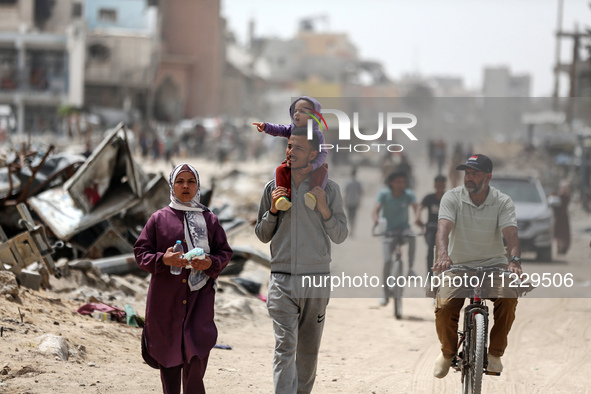 Displaced Palestinians are setting up shelter after returning to Khan Yunis in the southern Gaza Strip, amid the ongoing conflict between Is...