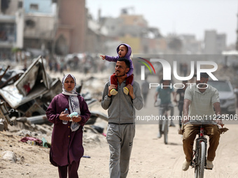 Displaced Palestinians are setting up shelter after returning to Khan Yunis in the southern Gaza Strip, amid the ongoing conflict between Is...