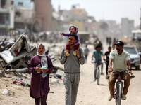 Displaced Palestinians are setting up shelter after returning to Khan Yunis in the southern Gaza Strip, amid the ongoing conflict between Is...