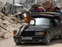 Displaced Palestinians are setting up shelter after returning to Khan Yunis in the southern Gaza Strip, amid the ongoing conflict between Is...