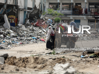 Displaced Palestinians are setting up shelter after returning to Khan Yunis in the southern Gaza Strip, amid the ongoing conflict between Is...