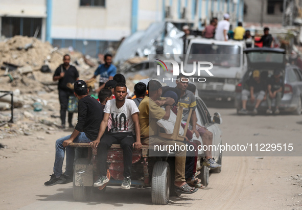 Displaced Palestinians are setting up shelter after returning to Khan Yunis in the southern Gaza Strip, amid the ongoing conflict between Is...