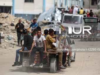 Displaced Palestinians are setting up shelter after returning to Khan Yunis in the southern Gaza Strip, amid the ongoing conflict between Is...