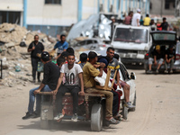 Displaced Palestinians are setting up shelter after returning to Khan Yunis in the southern Gaza Strip, amid the ongoing conflict between Is...