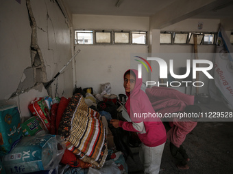 Displaced Palestinians are taking refuge inside a school to set up shelter amid the ongoing conflict between Israel and the Palestinian mili...