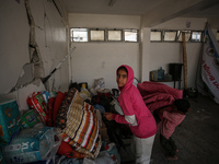 Displaced Palestinians are taking refuge inside a school to set up shelter amid the ongoing conflict between Israel and the Palestinian mili...