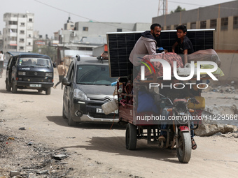 Displaced Palestinians are setting up shelter after returning to Khan Yunis in the southern Gaza Strip, amid the ongoing conflict between Is...