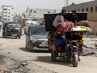 Displaced Palestinians are setting up shelter after returning to Khan Yunis in the southern Gaza Strip, amid the ongoing conflict between Is...