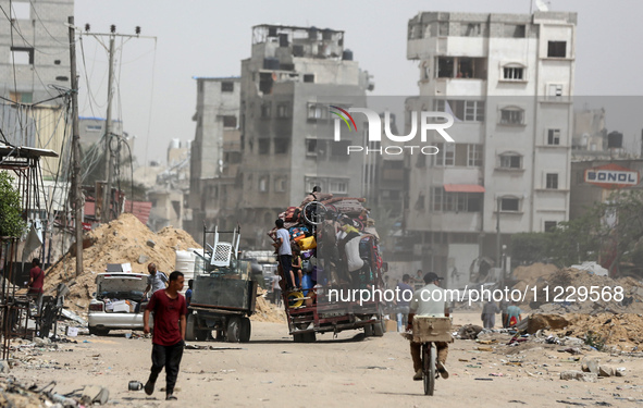 Displaced Palestinians are setting up shelter after returning to Khan Yunis in the southern Gaza Strip, amid the ongoing conflict between Is...