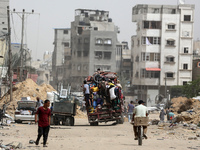 Displaced Palestinians are setting up shelter after returning to Khan Yunis in the southern Gaza Strip, amid the ongoing conflict between Is...