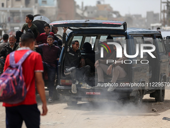 Displaced Palestinians are setting up shelter after returning to Khan Yunis in the southern Gaza Strip, amid the ongoing conflict between Is...