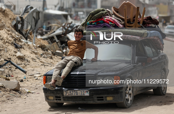 Displaced Palestinians are setting up shelter after returning to Khan Yunis in the southern Gaza Strip, amid the ongoing conflict between Is...