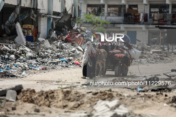 Displaced Palestinians are setting up shelter after returning to Khan Yunis in the southern Gaza Strip, amid the ongoing conflict between Is...