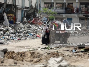 Displaced Palestinians are setting up shelter after returning to Khan Yunis in the southern Gaza Strip, amid the ongoing conflict between Is...