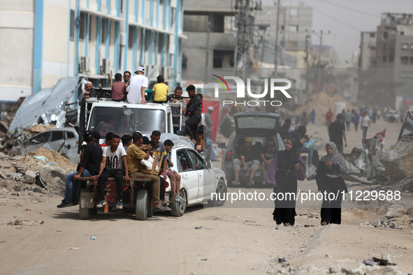 Displaced Palestinians are setting up shelter after returning to Khan Yunis in the southern Gaza Strip, amid the ongoing conflict between Is...