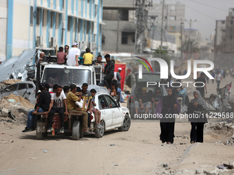 Displaced Palestinians are setting up shelter after returning to Khan Yunis in the southern Gaza Strip, amid the ongoing conflict between Is...