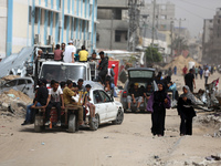 Displaced Palestinians are setting up shelter after returning to Khan Yunis in the southern Gaza Strip, amid the ongoing conflict between Is...