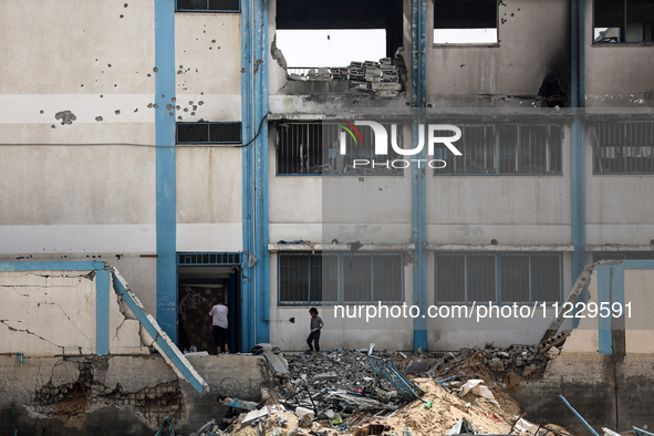 Displaced Palestinians are taking refuge inside a school to set up shelter amid the ongoing conflict between Israel and the Palestinian mili...