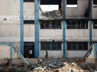 Displaced Palestinians are taking refuge inside a school to set up shelter amid the ongoing conflict between Israel and the Palestinian mili...