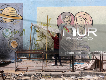 Displaced Palestinians are taking refuge inside a school to set up shelter amid the ongoing conflict between Israel and the Palestinian mili...