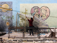 Displaced Palestinians are taking refuge inside a school to set up shelter amid the ongoing conflict between Israel and the Palestinian mili...