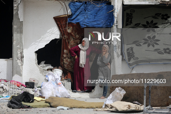 Displaced Palestinians are taking refuge inside a school to set up shelter amid the ongoing conflict between Israel and the Palestinian mili...