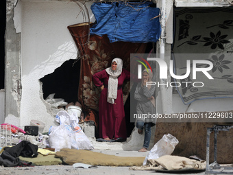 Displaced Palestinians are taking refuge inside a school to set up shelter amid the ongoing conflict between Israel and the Palestinian mili...