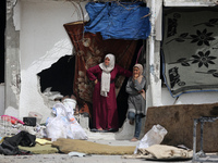 Displaced Palestinians are taking refuge inside a school to set up shelter amid the ongoing conflict between Israel and the Palestinian mili...