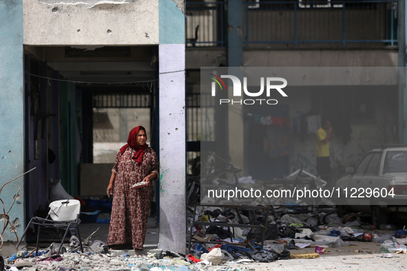 Displaced Palestinians are taking refuge inside a school to set up shelter amid the ongoing conflict between Israel and the Palestinian mili...