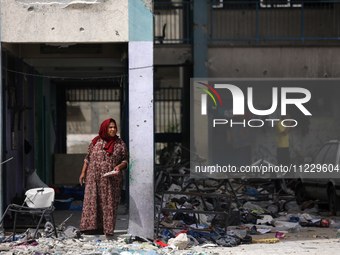 Displaced Palestinians are taking refuge inside a school to set up shelter amid the ongoing conflict between Israel and the Palestinian mili...