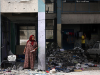 Displaced Palestinians are taking refuge inside a school to set up shelter amid the ongoing conflict between Israel and the Palestinian mili...