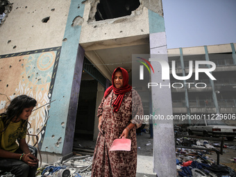 Displaced Palestinians are taking refuge inside a school to set up shelter amid the ongoing conflict between Israel and the Palestinian mili...