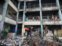 Displaced Palestinians are taking refuge inside a school to set up shelter amid the ongoing conflict between Israel and the Palestinian mili...