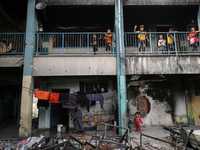 Displaced Palestinians are taking refuge inside a school to set up shelter amid the ongoing conflict between Israel and the Palestinian mili...